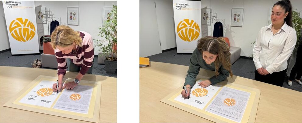 Zu sehen sind die Mitglieder Schülervertretung und des Personalrats bei der Unterzeichnung der Schulvereinbarung